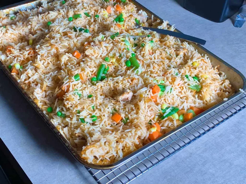 https://www.sizzleandsear.com/wp-content/uploads/2020/10/one-pan-steamed-rice-and-chicken-in-an-anova-precision-oven-1024x768.webp